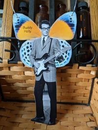 Buddy Holly Paper Angel hangs from a wire, as seen on CrossEyedCatGifts, Etsy
